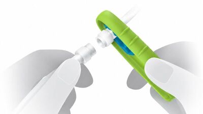 Gloved hands separating the two halves of a connection after using Yewtwist