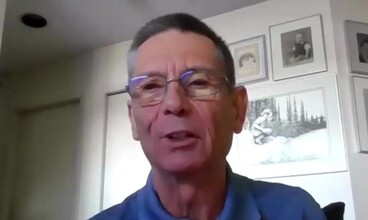 Gerry speaking to the camera from his home